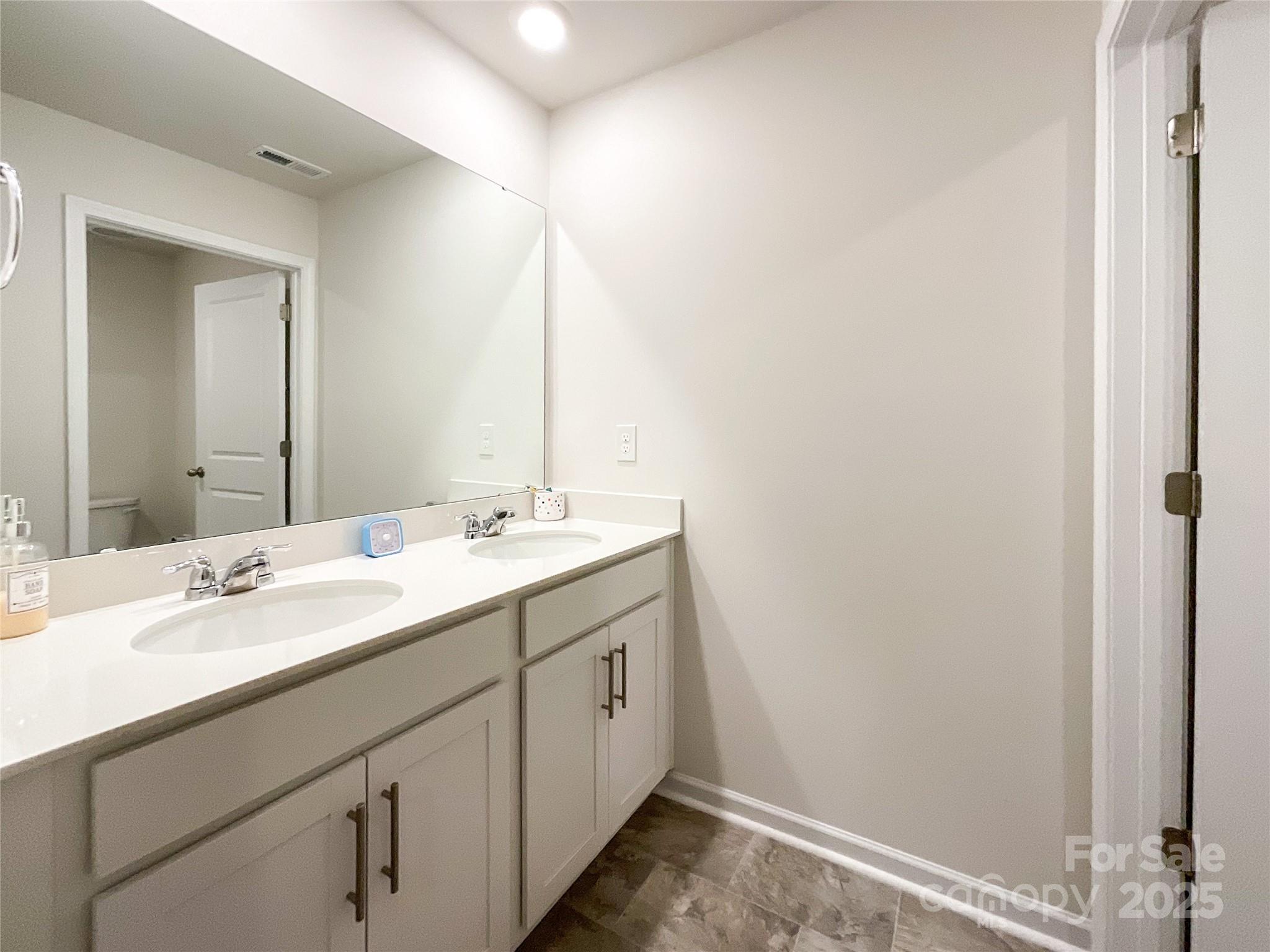 2159 Vanderlyn Street Monroe, NC 28112 - Photo 29 of 44 a bathroom with a sink and a mirror