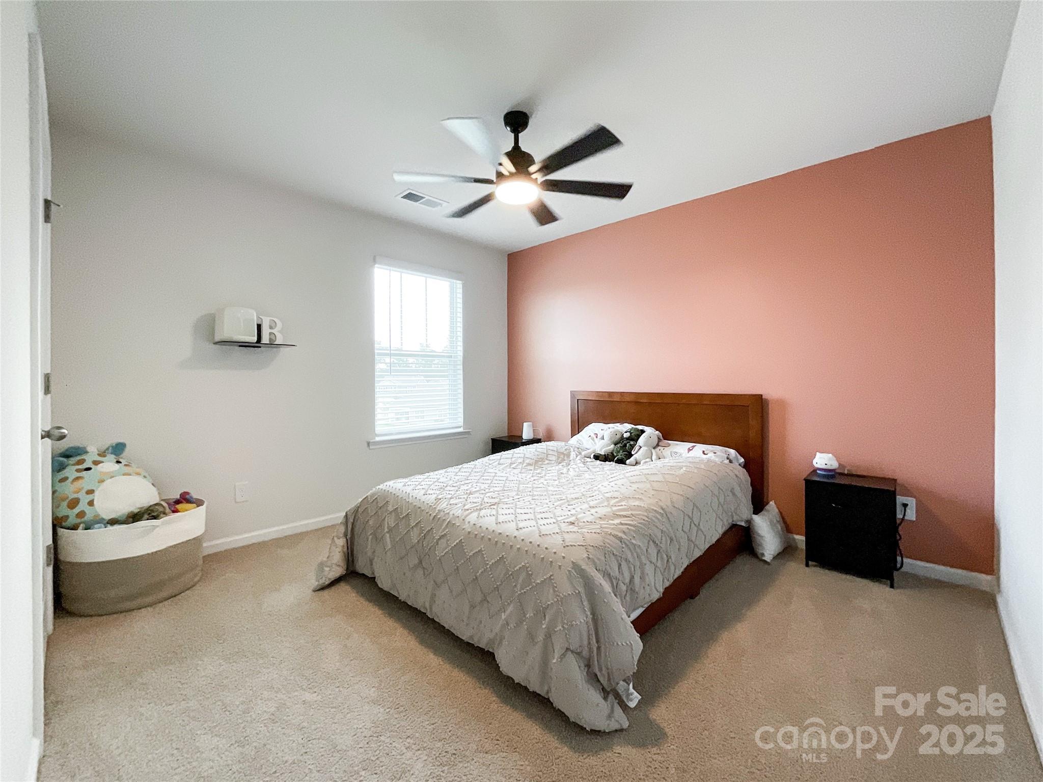 2159 Vanderlyn Street Monroe, NC 28112 - Photo 31 of 44 a bedroom with a bed and a window