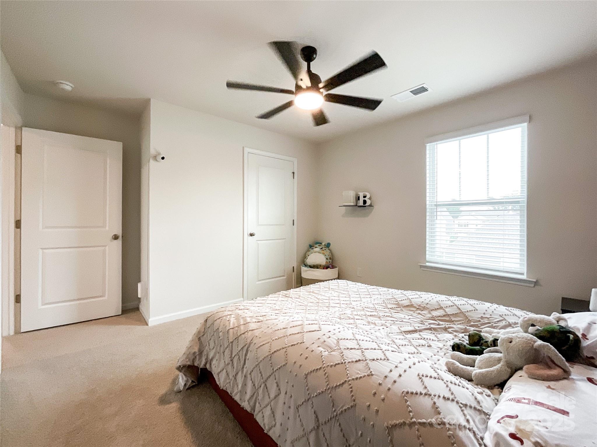 2159 Vanderlyn Street Monroe, NC 28112 - Photo 32 of 44 a bedroom with a bed and a window