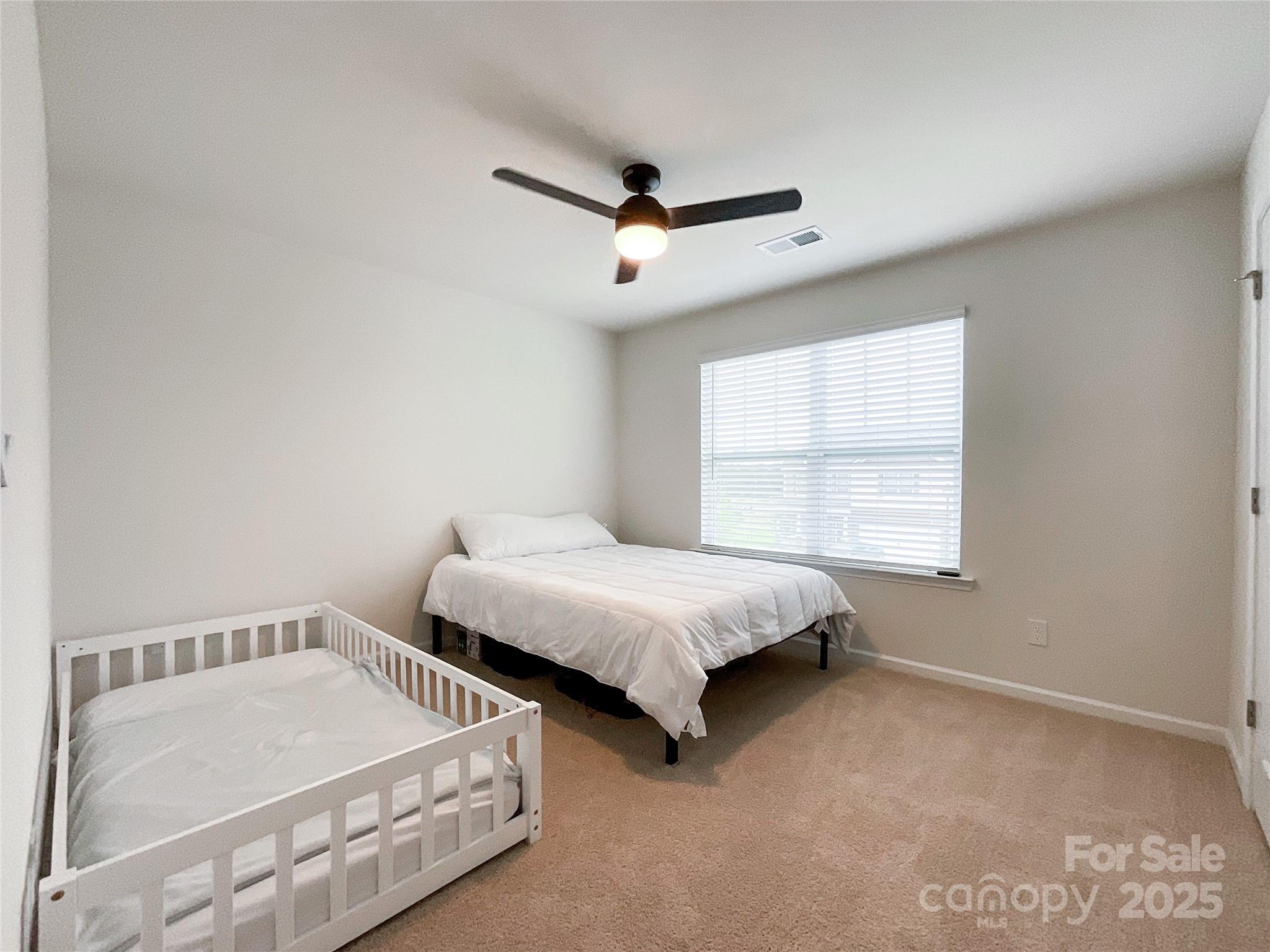 2159 Vanderlyn Street Monroe, NC 28112 - Photo 33 of 44 a bedroom with two beds and window