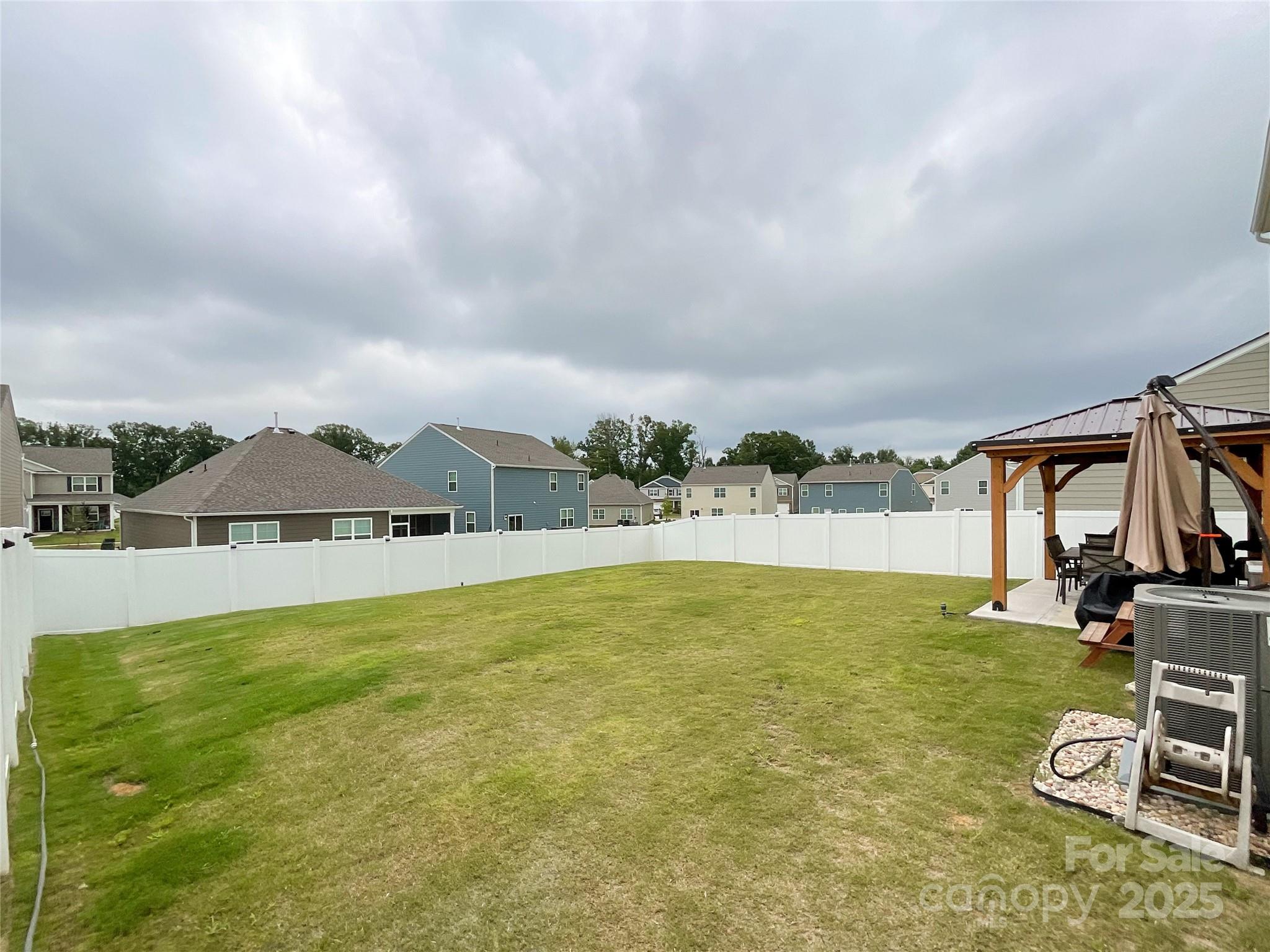 2159 Vanderlyn Street Monroe, NC 28112 - Photo 38 of 44 a view of swimming pool with lawn chairs and large trees