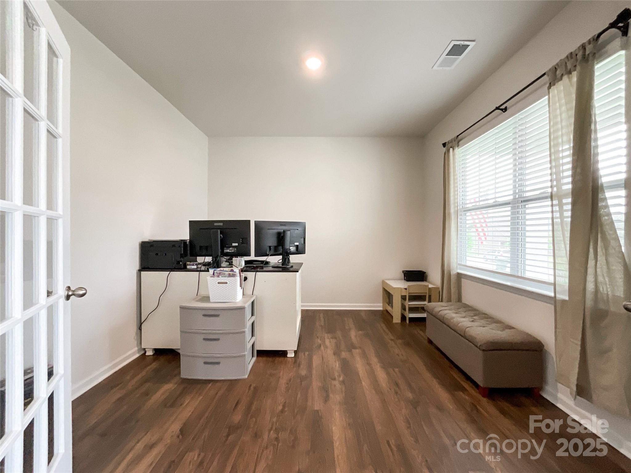 2159 Vanderlyn Street Monroe, NC 28112 - Photo 4 of 44 a living room with furniture and a flat screen tv