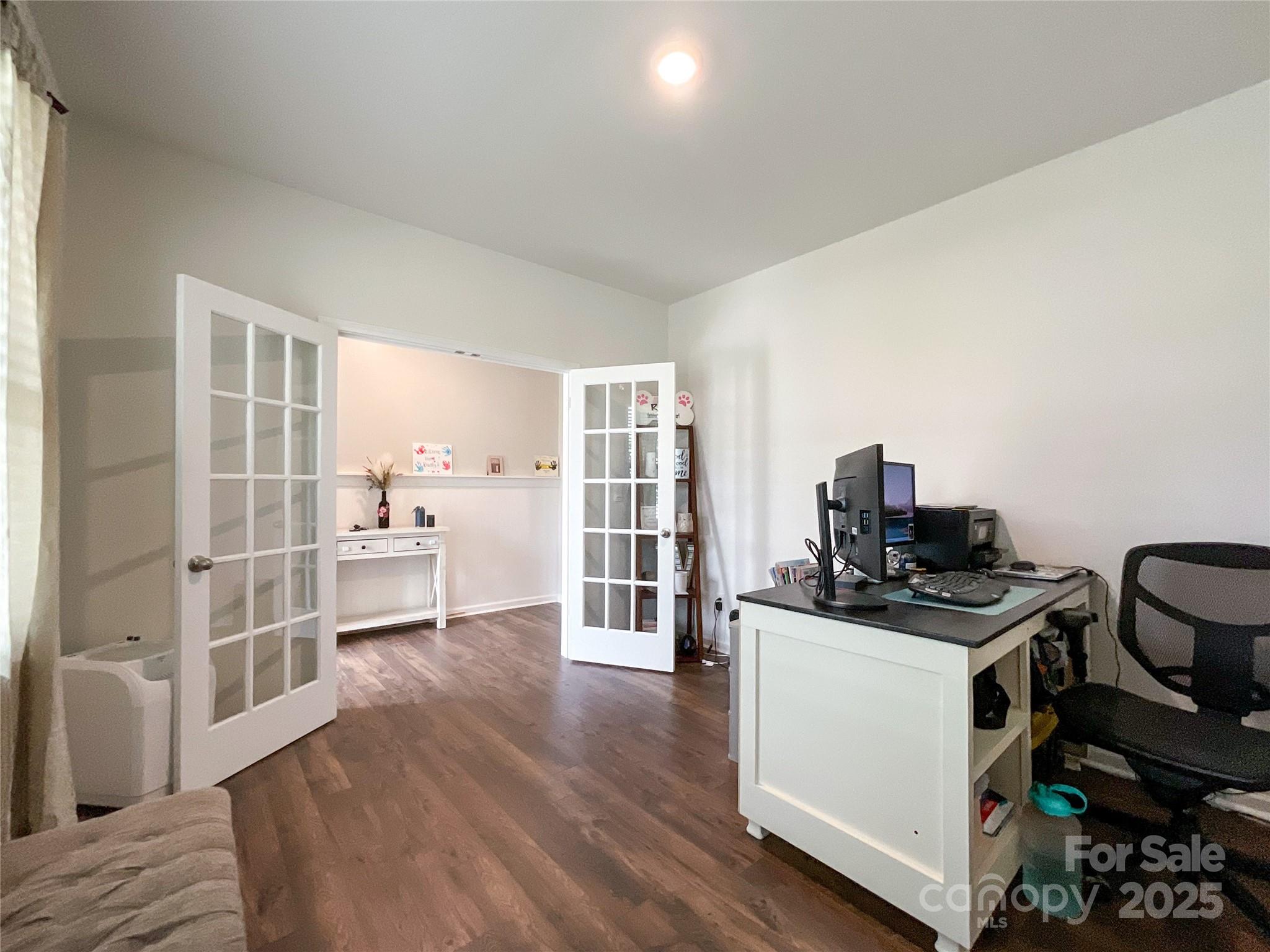 2159 Vanderlyn Street Monroe, NC 28112 - Photo 5 of 44 a view of a kitchen with furniture and wooden floor