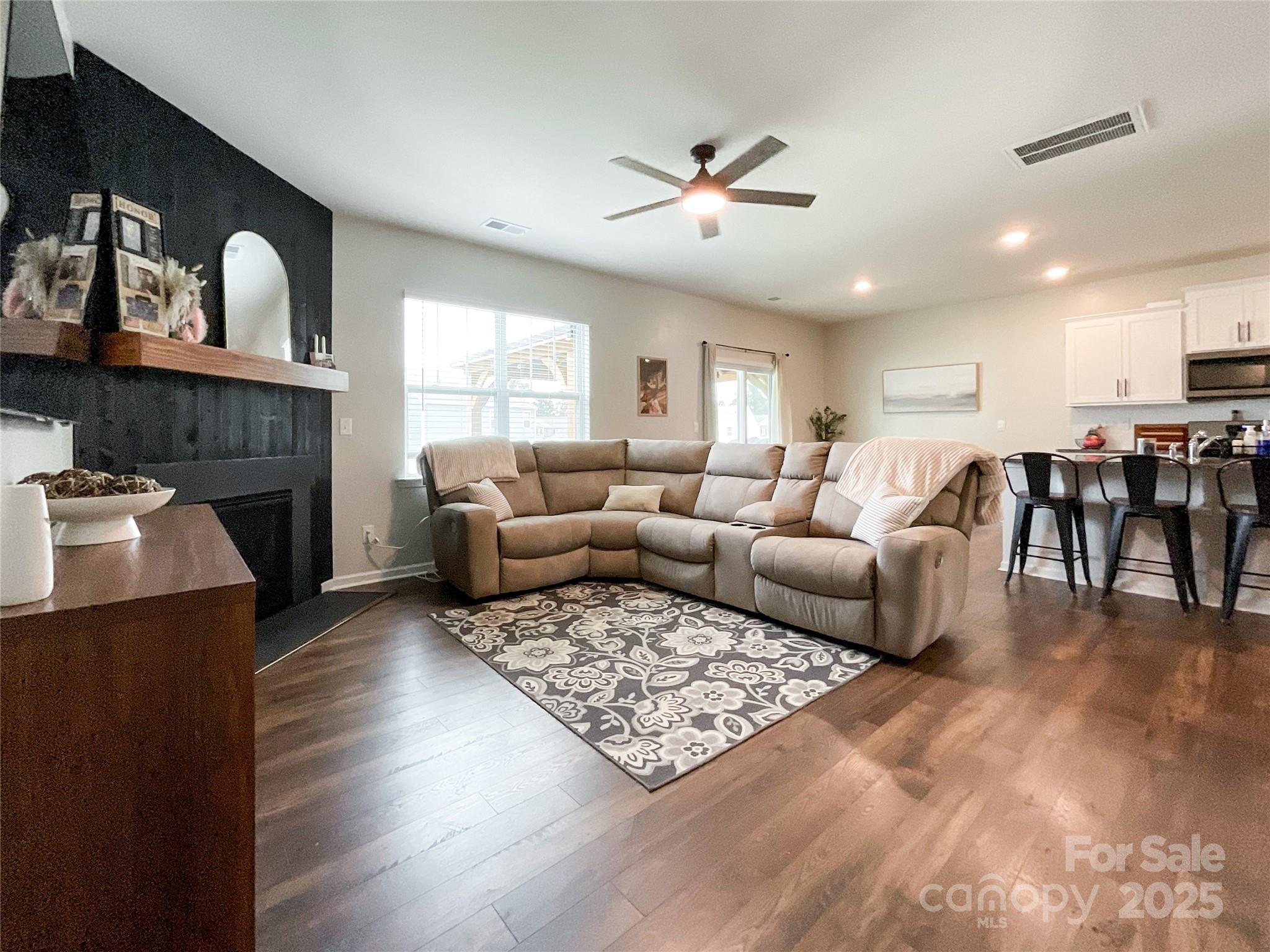 2159 Vanderlyn Street Monroe, NC 28112 - Photo 6 of 44 a living room with furniture and a fireplace