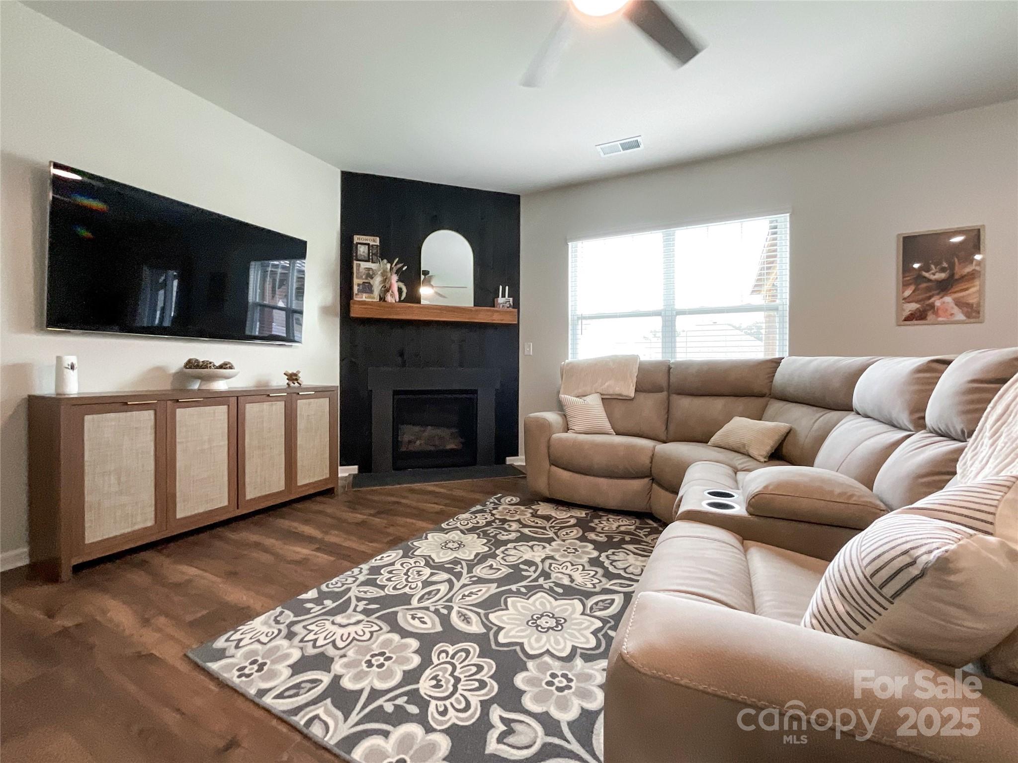 2159 Vanderlyn Street Monroe, NC 28112 - Photo 8 of 44 a living room with furniture and a fireplace