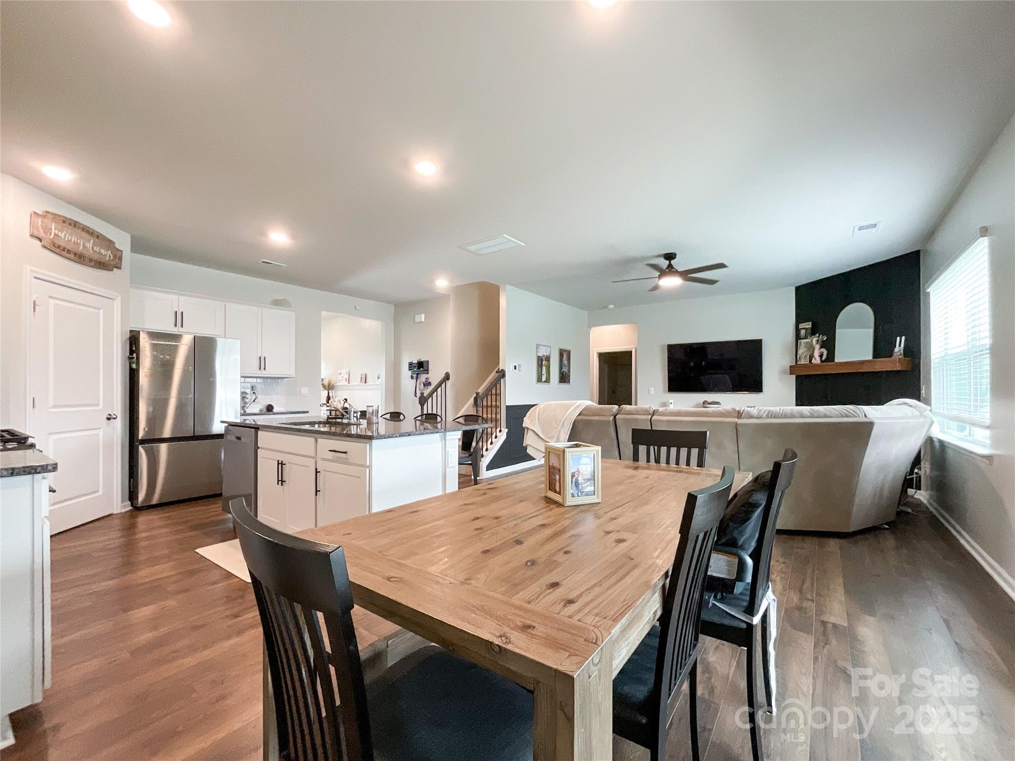 2159 Vanderlyn Street Monroe, NC 28112 - Photo 9 of 44 a large kitchen with a table and chairs