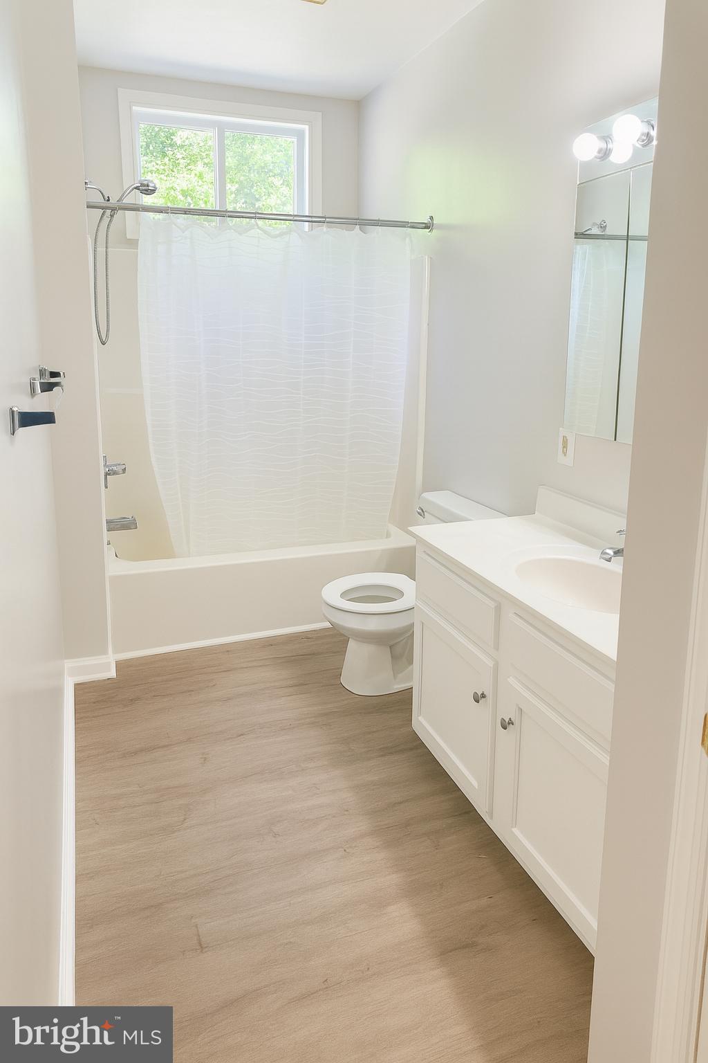 9513 Hansonville Road, Unit B Frederick, MD 21702 - Photo 6 of 7 a bathroom with a sink a toilet and shower