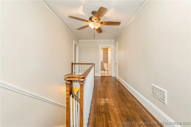 a view of a hallway with a window