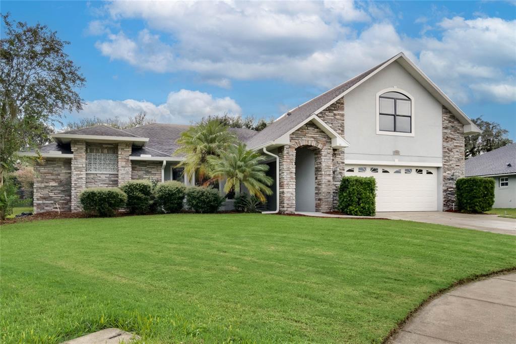 156 Rachel Lin Lane St. Cloud, FL 34771 - Photo 1 of 1 a front view of a house with garden