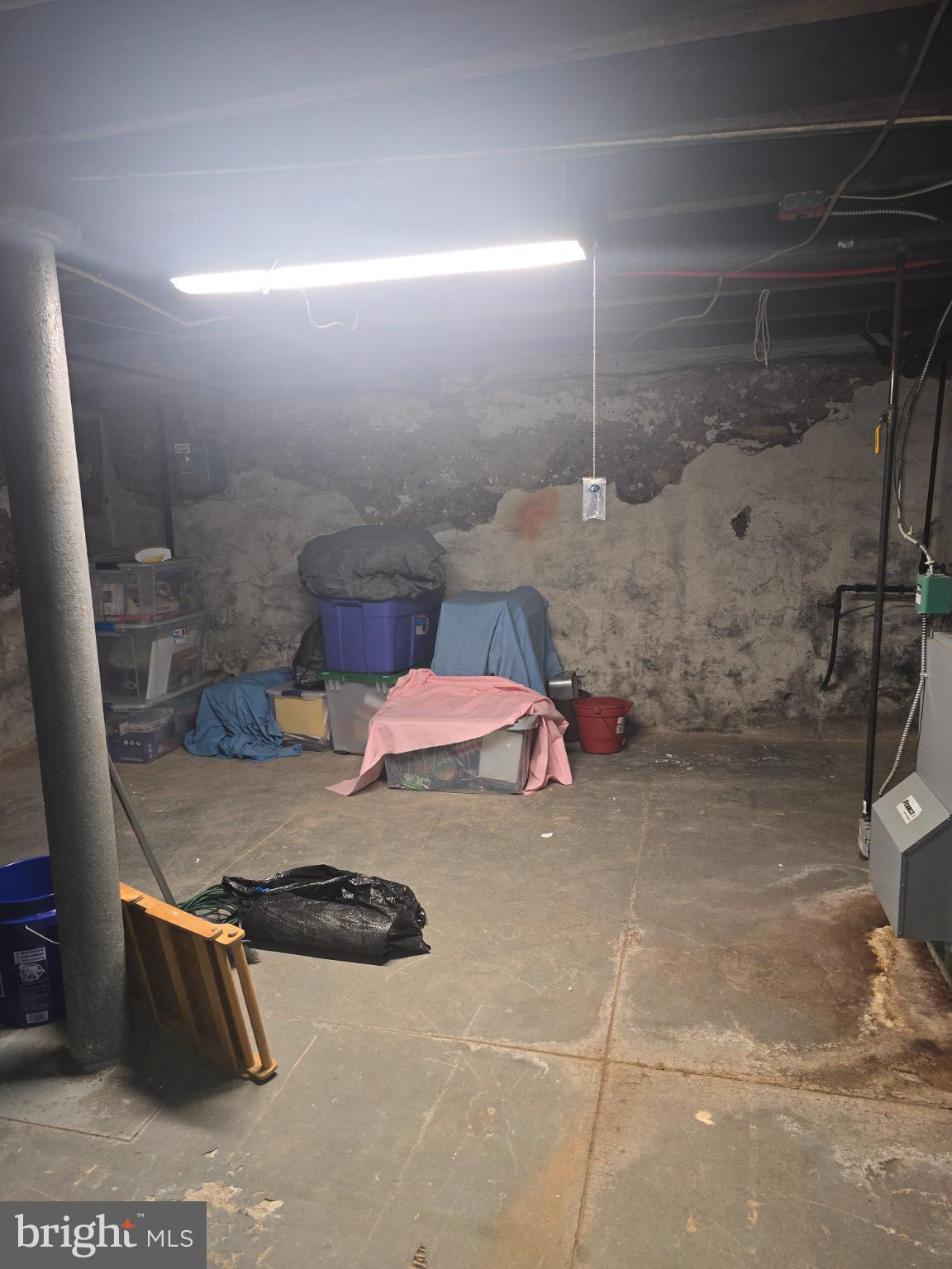 30 East Mowry Street Chester, PA 19013 - Photo 12 of 15 Spacious basement with potential for transforma...