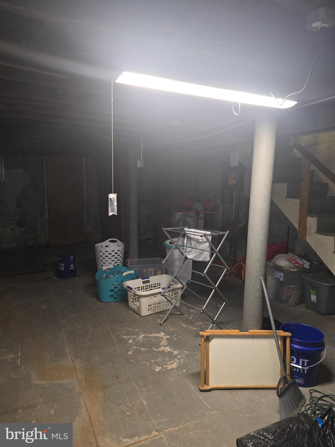 30 East Mowry Street Chester, PA 19013 - Photo 14 of 15 Spacious basement with ample storage potential.