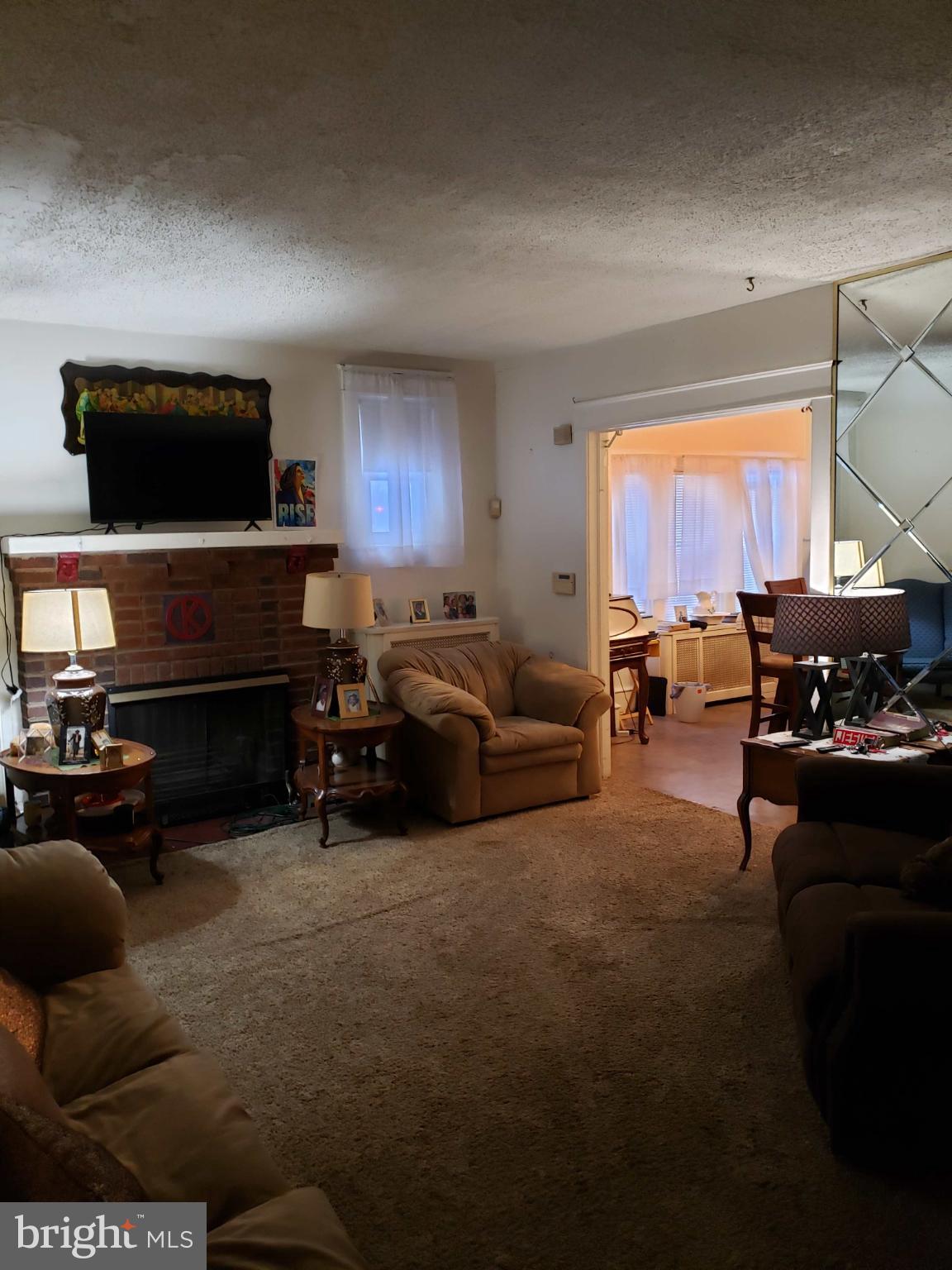 30 East Mowry Street Chester, PA 19013 - Photo 3 of 15 Cozy living space with inviting warmth.