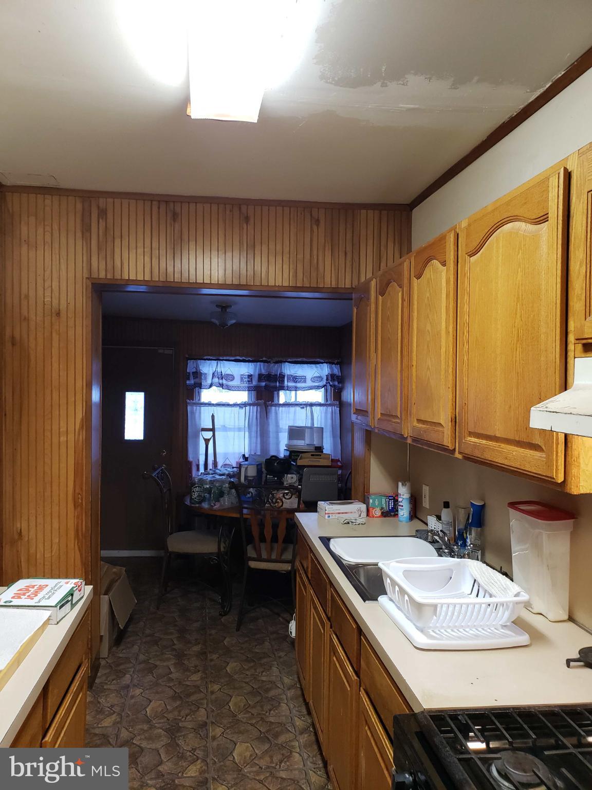 30 East Mowry Street Chester, PA 19013 - Photo 6 of 15 Cozy kitchen with warm wooden accents.