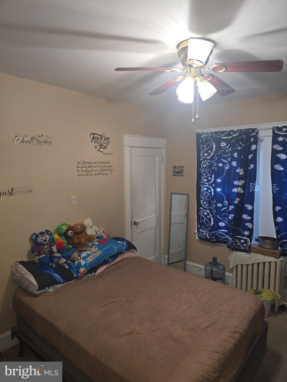 30 East Mowry Street Chester, PA 19013 - Photo 7 of 15 Cozy bedroom with playful decor and charm.