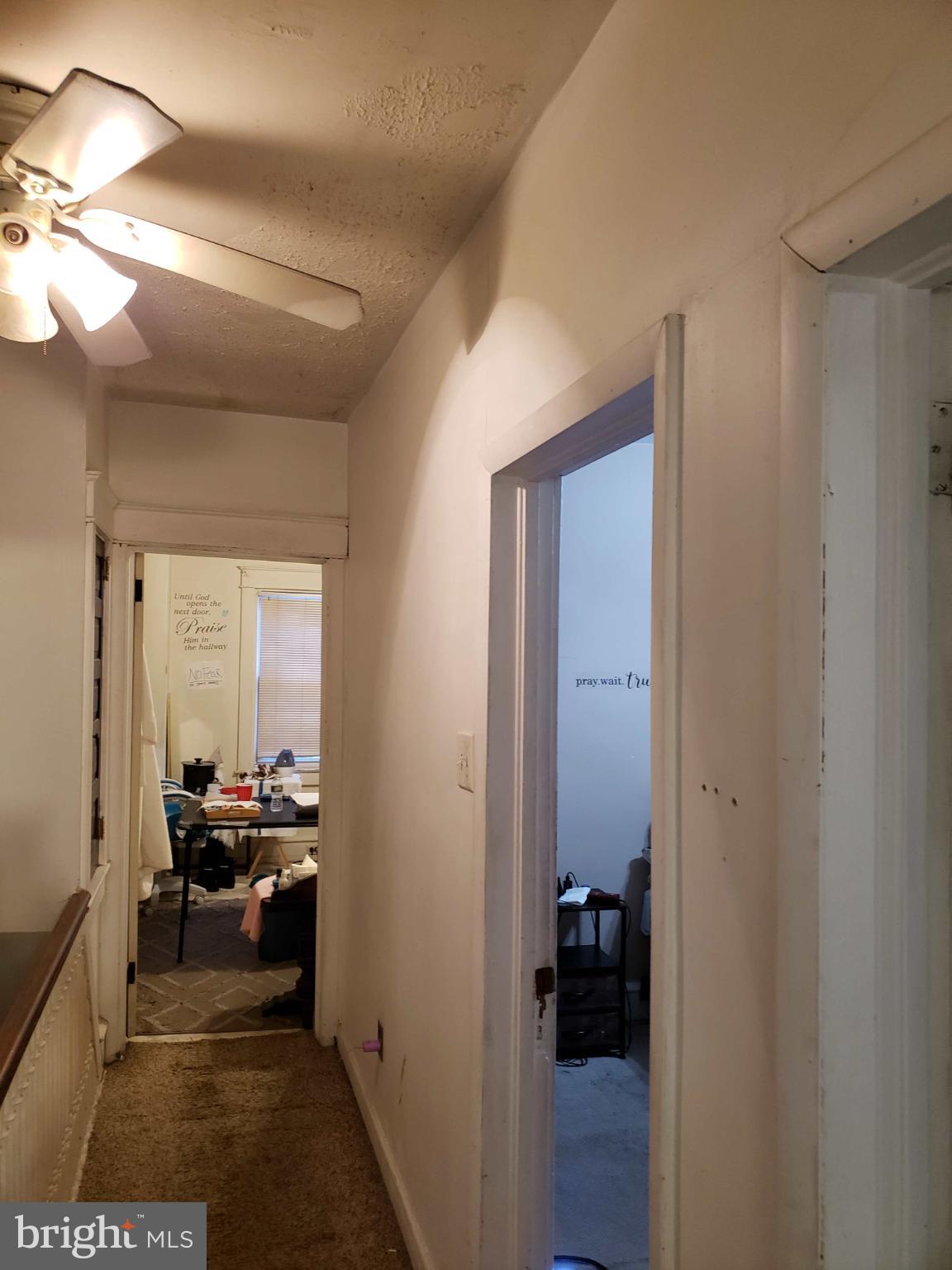 30 East Mowry Street Chester, PA 19013 - Photo 10 of 15 Bright hallway with inviting doorways.