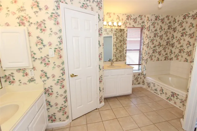 a bathroom with a sink a bathtub and a shower