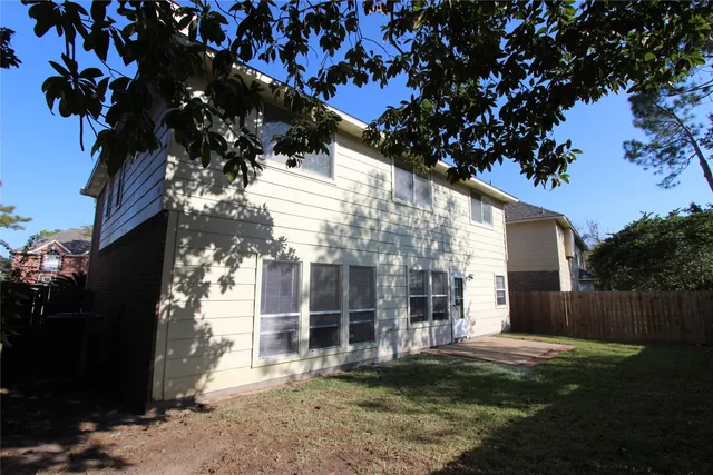 a view of a house with a tree
