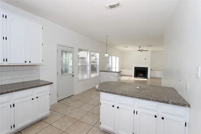 a kitchen with granite countertop a sink and a granite counter tops