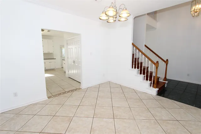 a view of an entryway and livingroom