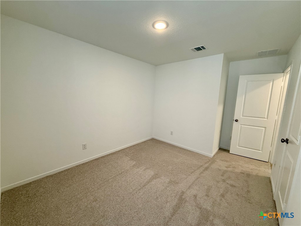 311 Moscato Road New Braunfels, TX 78130 - Photo 30 of 38 an empty room with white door
