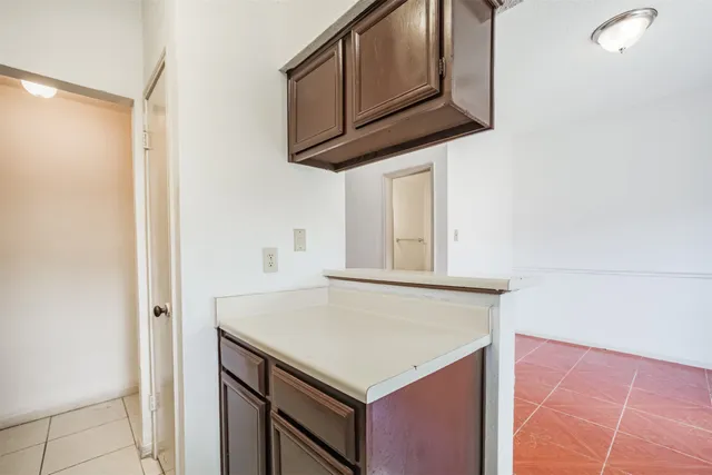 a kitchen with a cabinets and a stove top oven