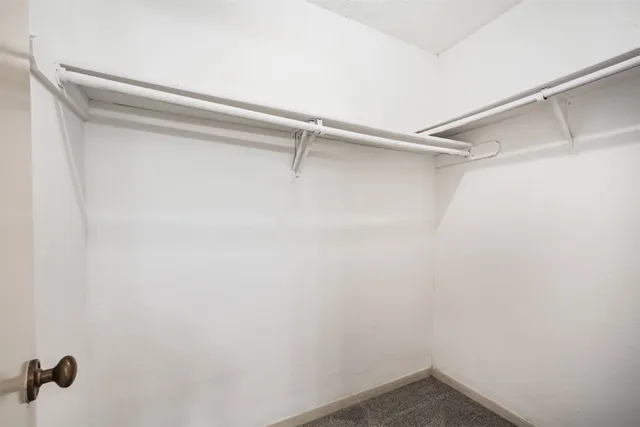 a view of a room with shelf on the wall