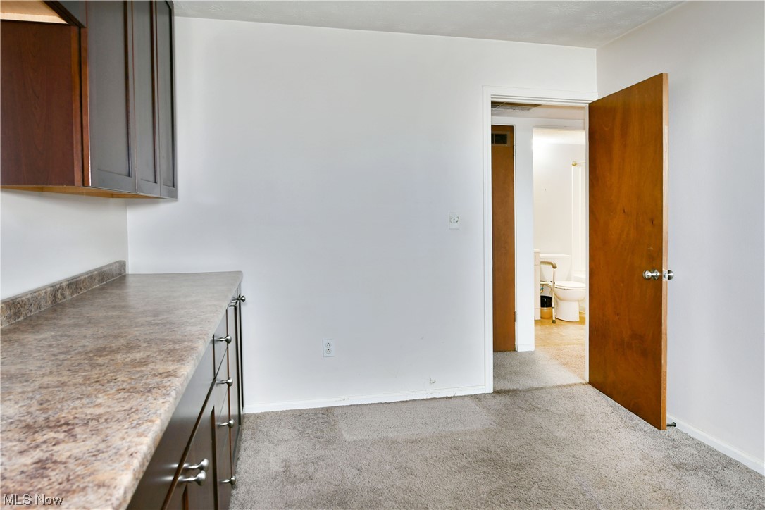 2980 North River Road Northeast, Unit E3 Warren, OH 44483 - Photo 16 of 27 Bedroom with light carpet