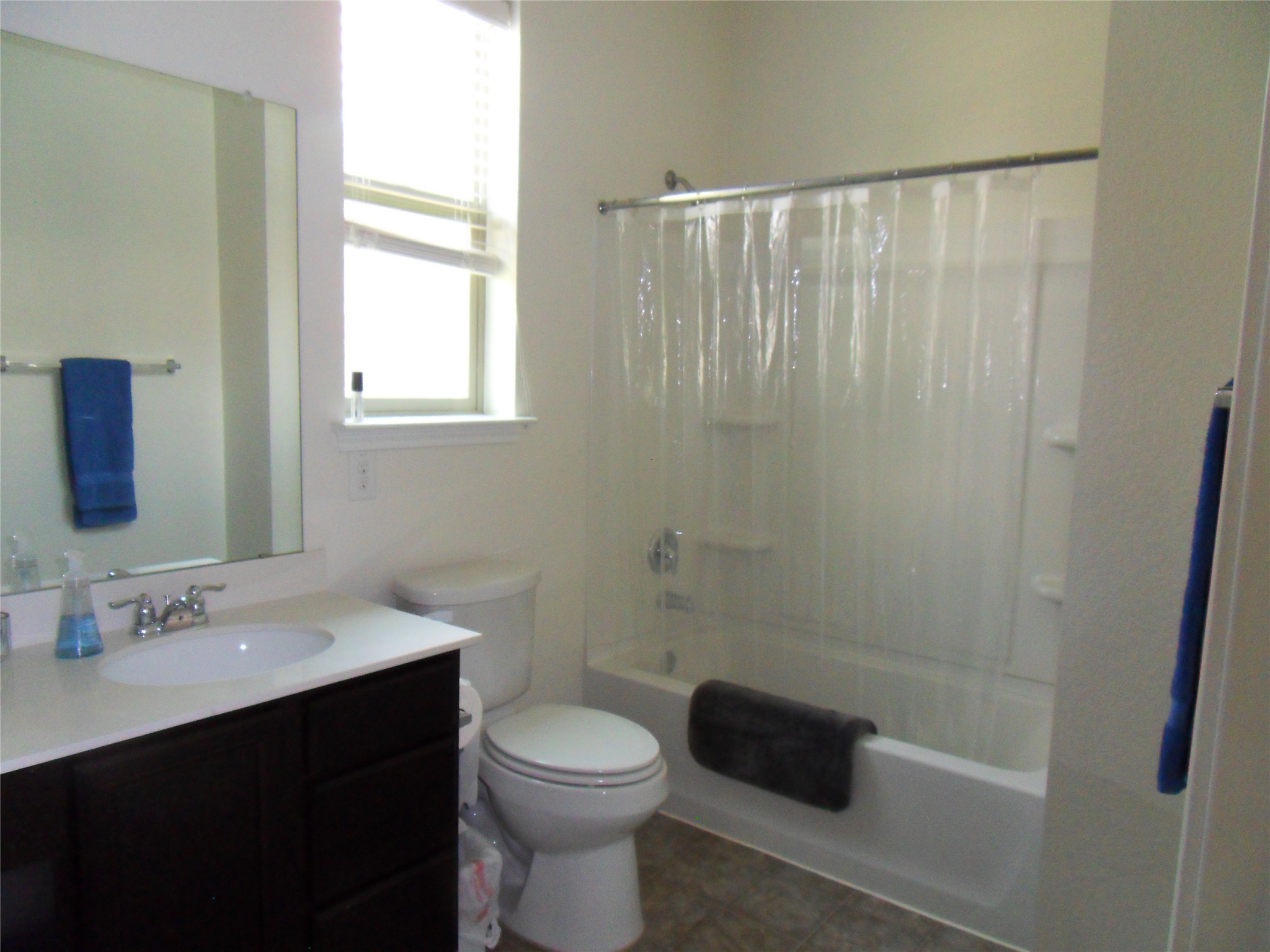 11013 Kirkoswald Road Austin, TX 78754 - Photo 14 of 20 A window bathes this classic bathroom in natural light.