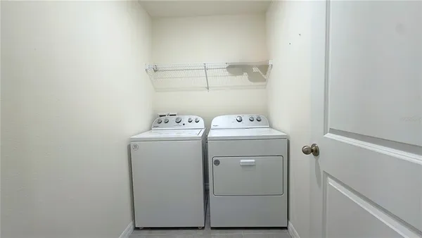 a utility room with dryer and washer