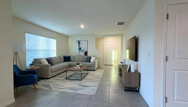 a living room with furniture and a window