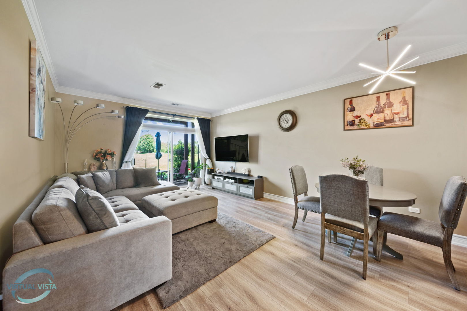 24155 Pear Tree Circle Plainfield, IL 60585 - Photo 12 of 27 a living room with furniture wooden floor and a flat screen tv