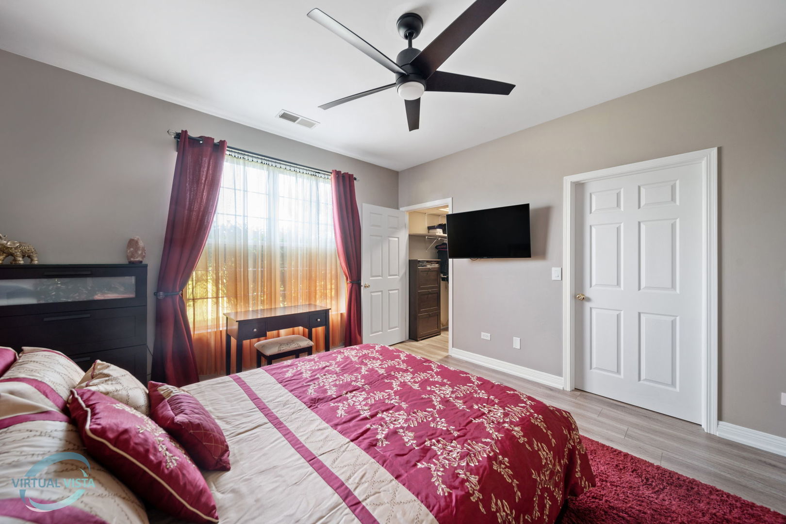 24155 Pear Tree Circle Plainfield, IL 60585 - Photo 14 of 27 a bedroom with a bed and a flat screen tv