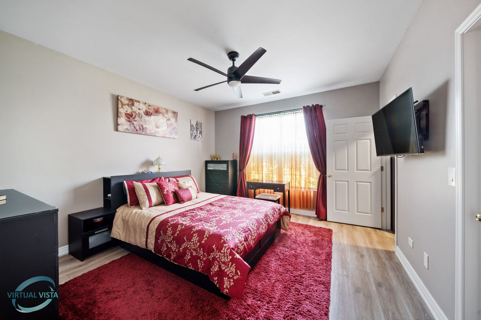 24155 Pear Tree Circle Plainfield, IL 60585 - Photo 15 of 27 a bedroom with a bed and a flat screen tv