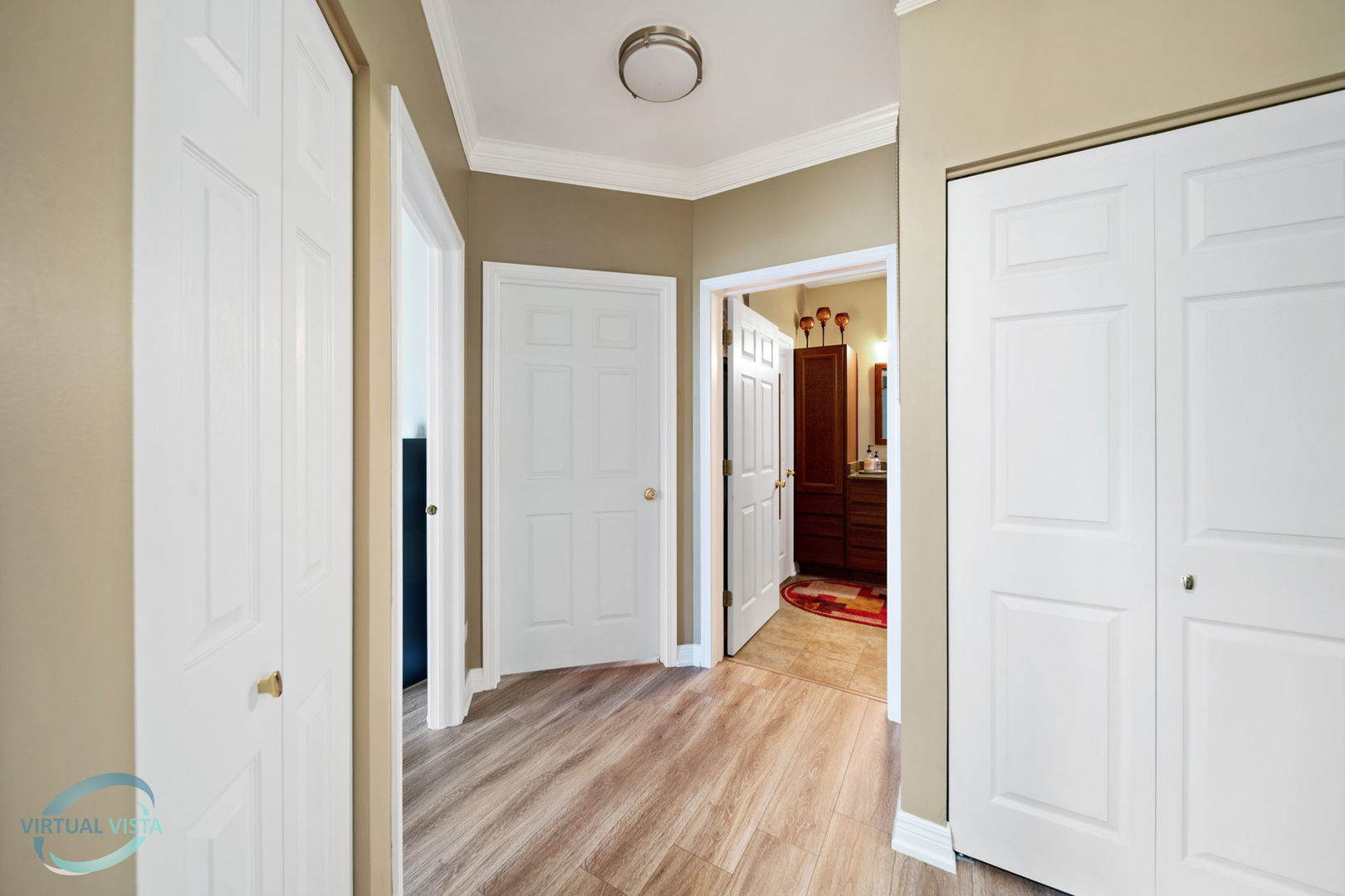 24155 Pear Tree Circle Plainfield, IL 60585 - Photo 18 of 27 a view of a hallway with wooden floor and bathroom