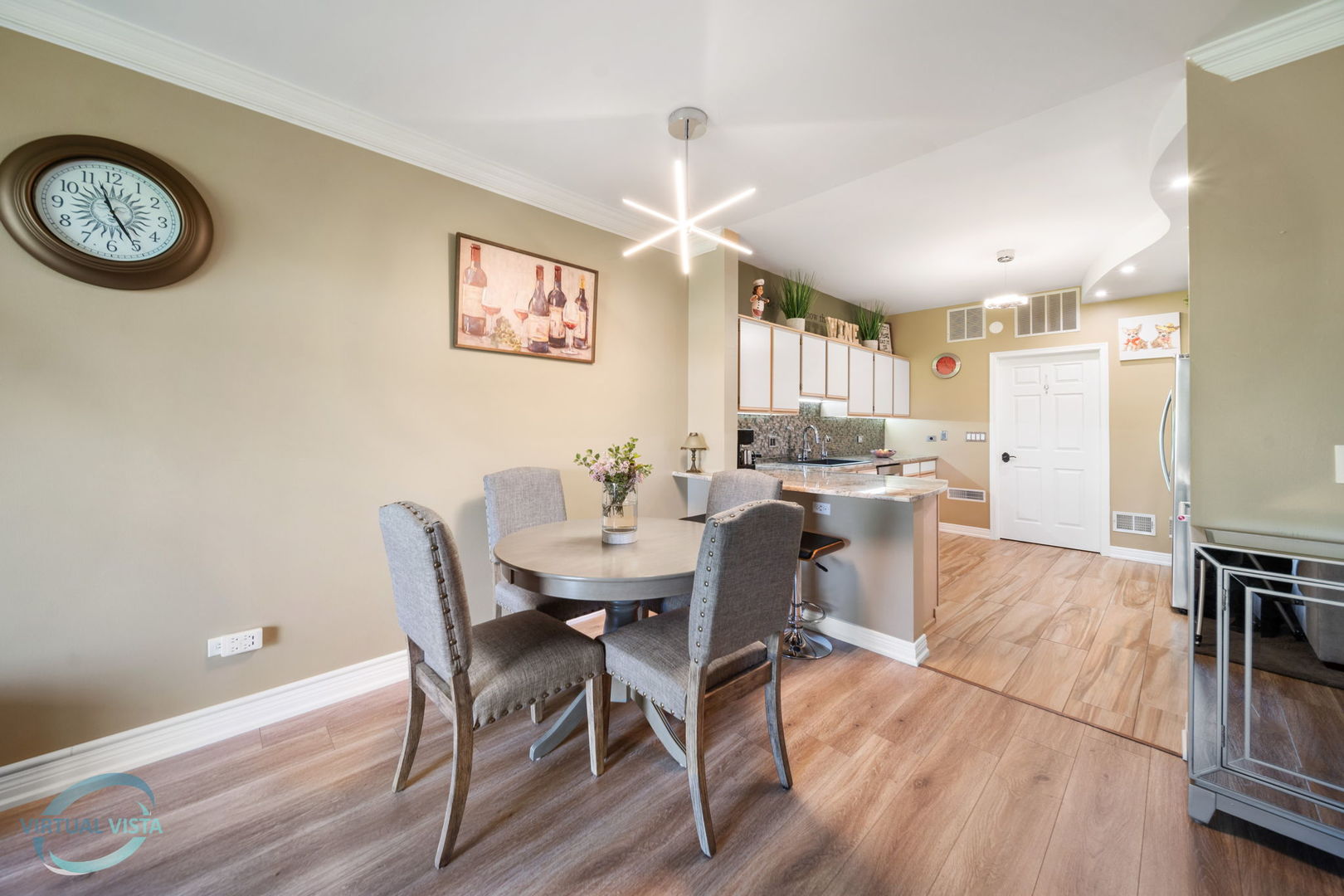 24155 Pear Tree Circle Plainfield, IL 60585 - Photo 3 of 27 a view of a dining room with furniture and wooden floor