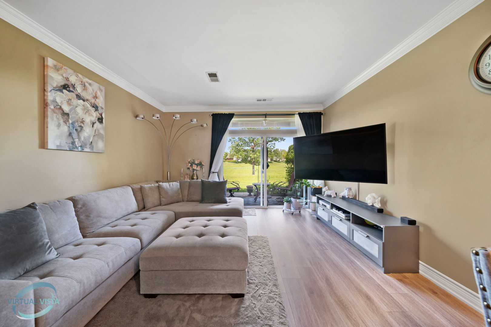 24155 Pear Tree Circle Plainfield, IL 60585 - Photo 4 of 27 a living room with furniture and a flat screen tv
