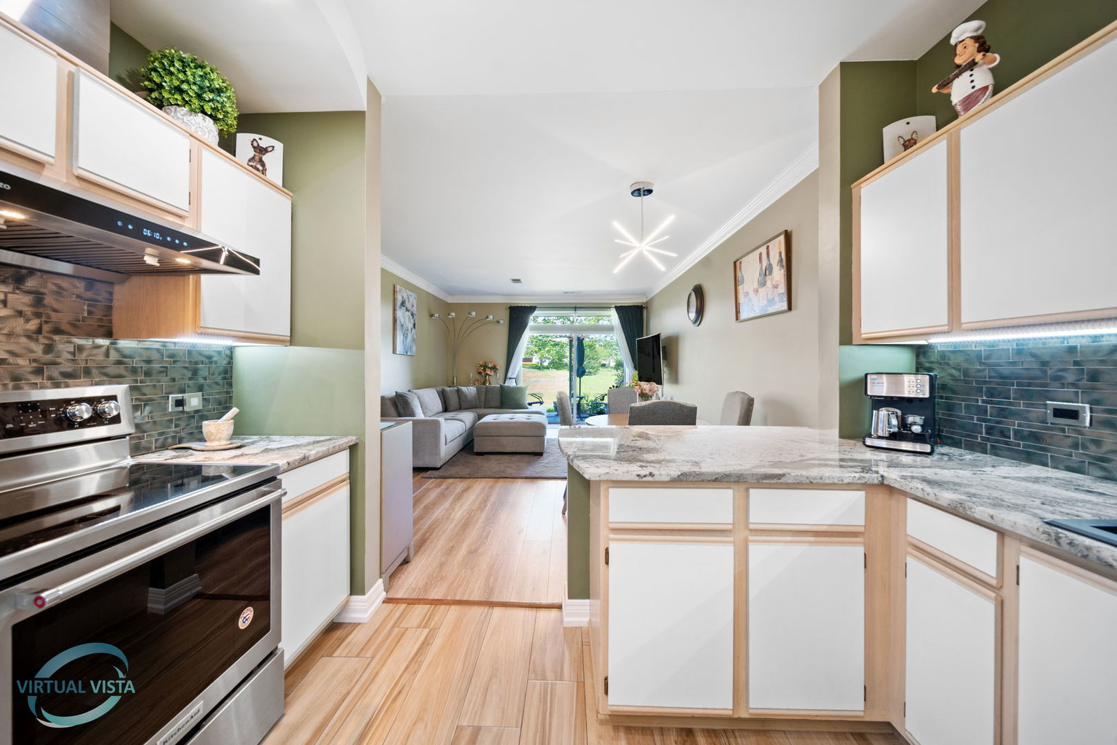 24155 Pear Tree Circle Plainfield, IL 60585 - Photo 7 of 27 a kitchen with stainless steel appliances granite countertop a stove and a sink