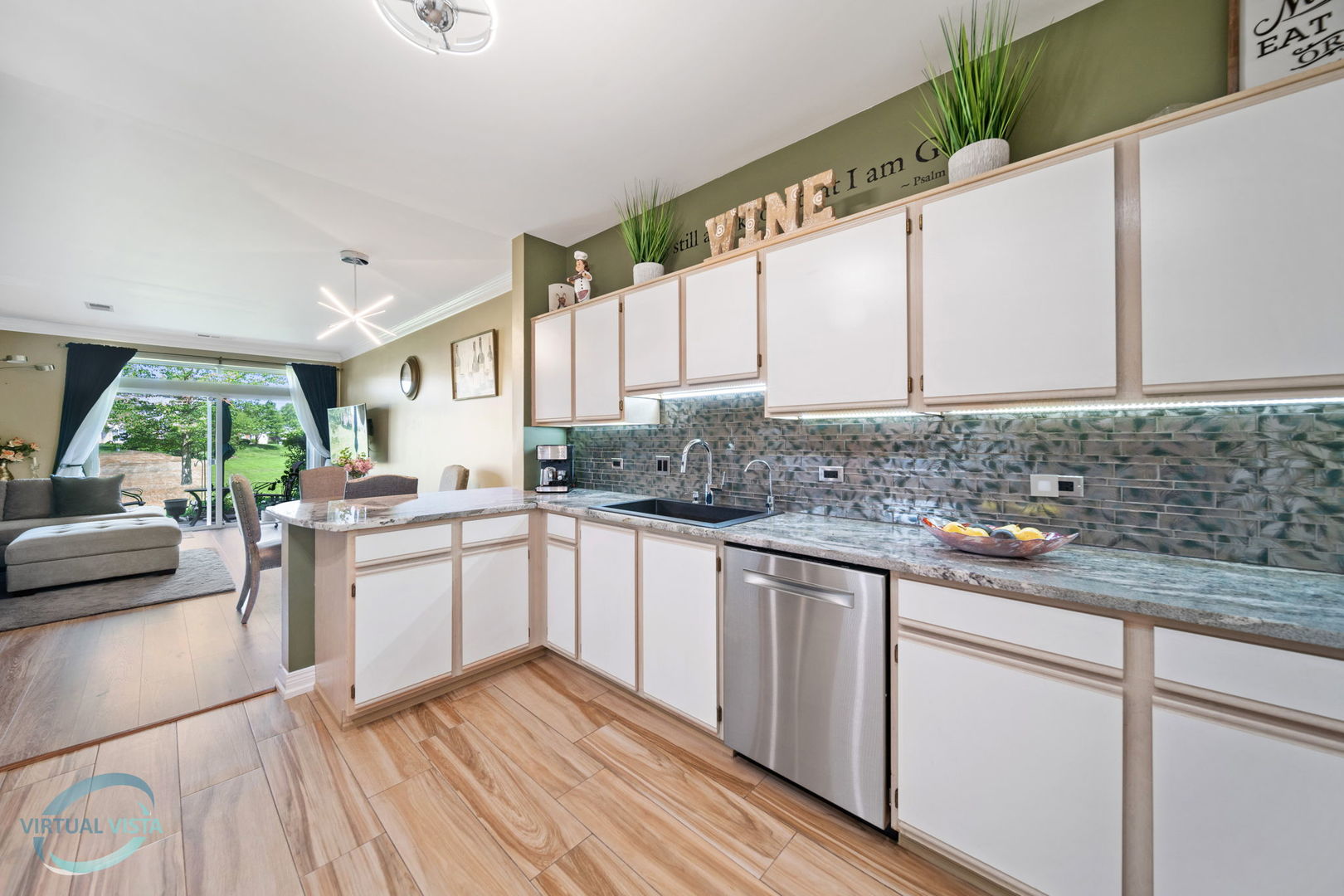 24155 Pear Tree Circle Plainfield, IL 60585 - Photo 8 of 27 a kitchen with a sink stove and cabinets