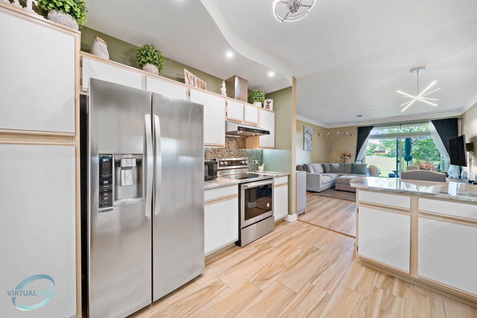 24155 Pear Tree Circle Plainfield, IL 60585 - Photo 9 of 27 a kitchen with stainless steel appliances a refrigerator sink and stove