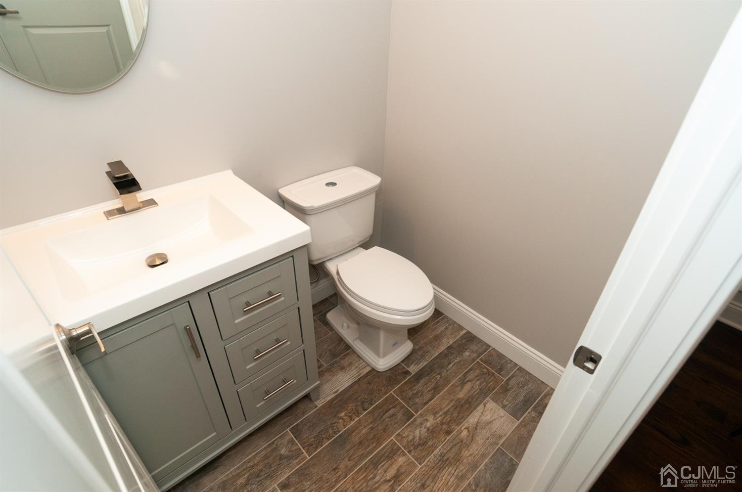 21 Stockton Road New Brunswick, NJ 08901 - Photo 11 of 45 a bathroom with a toilet and a sink