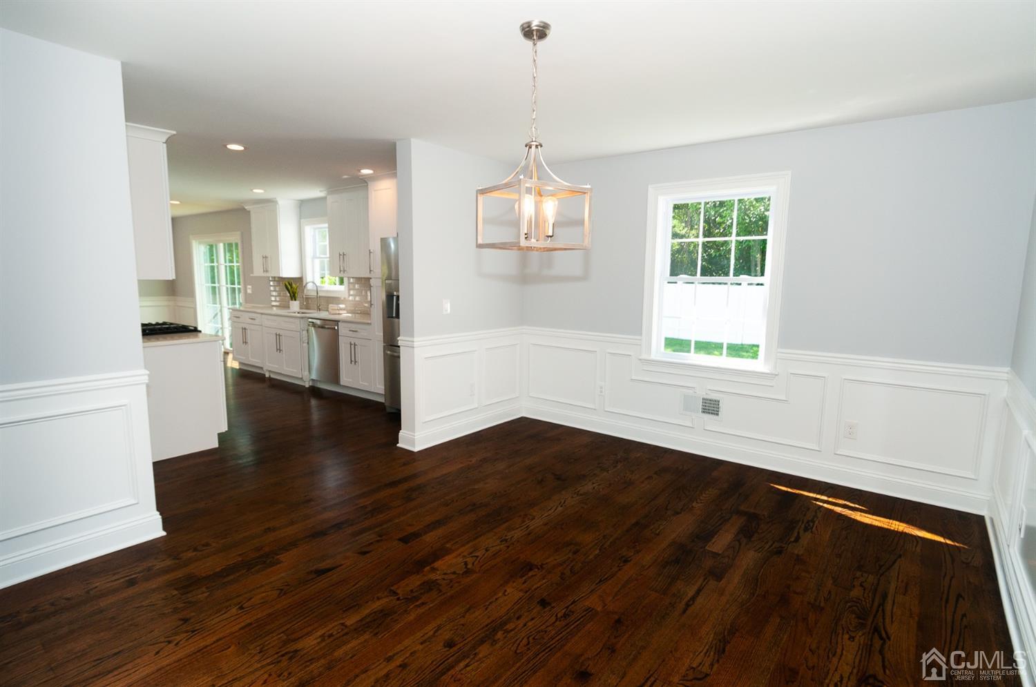 21 Stockton Road New Brunswick, NJ 08901 - Photo 12 of 45 a view of an empty room with wooden floor and a window