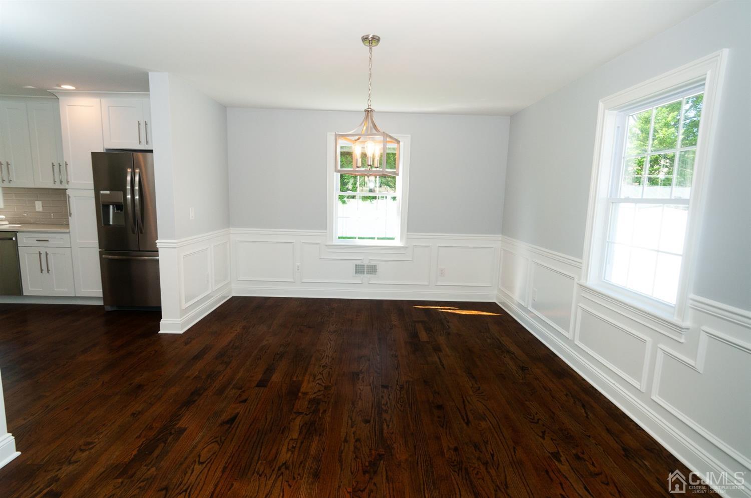 21 Stockton Road New Brunswick, NJ 08901 - Photo 13 of 45 a view of an empty room with wooden floor and a window