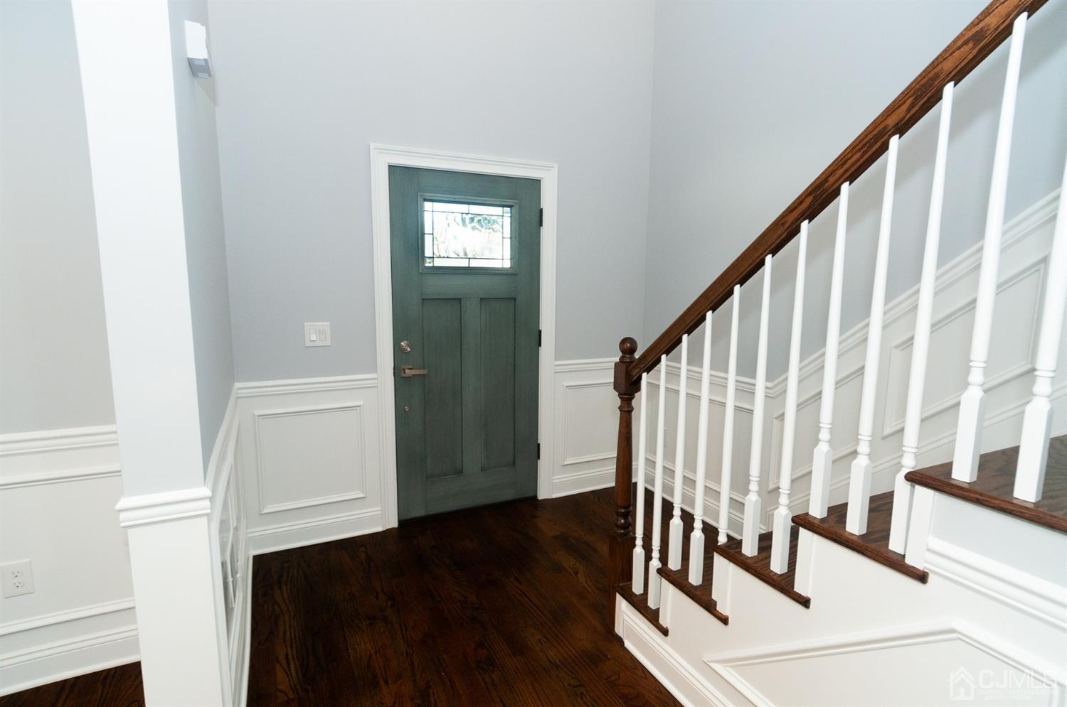 21 Stockton Road New Brunswick, NJ 08901 - Photo 14 of 45 a view of entryway with wooden floor and stairs