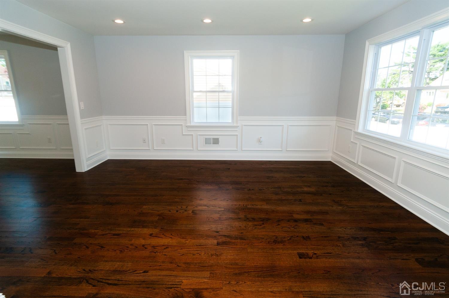 21 Stockton Road New Brunswick, NJ 08901 - Photo 16 of 45 an empty room with wooden floor and windows