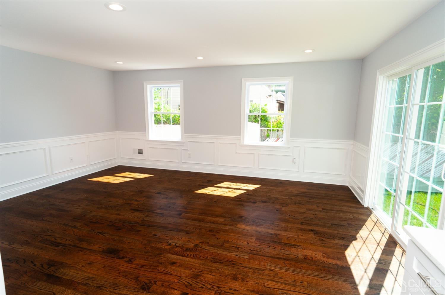21 Stockton Road New Brunswick, NJ 08901 - Photo 18 of 45 a view of empty room with wooden floor and fan