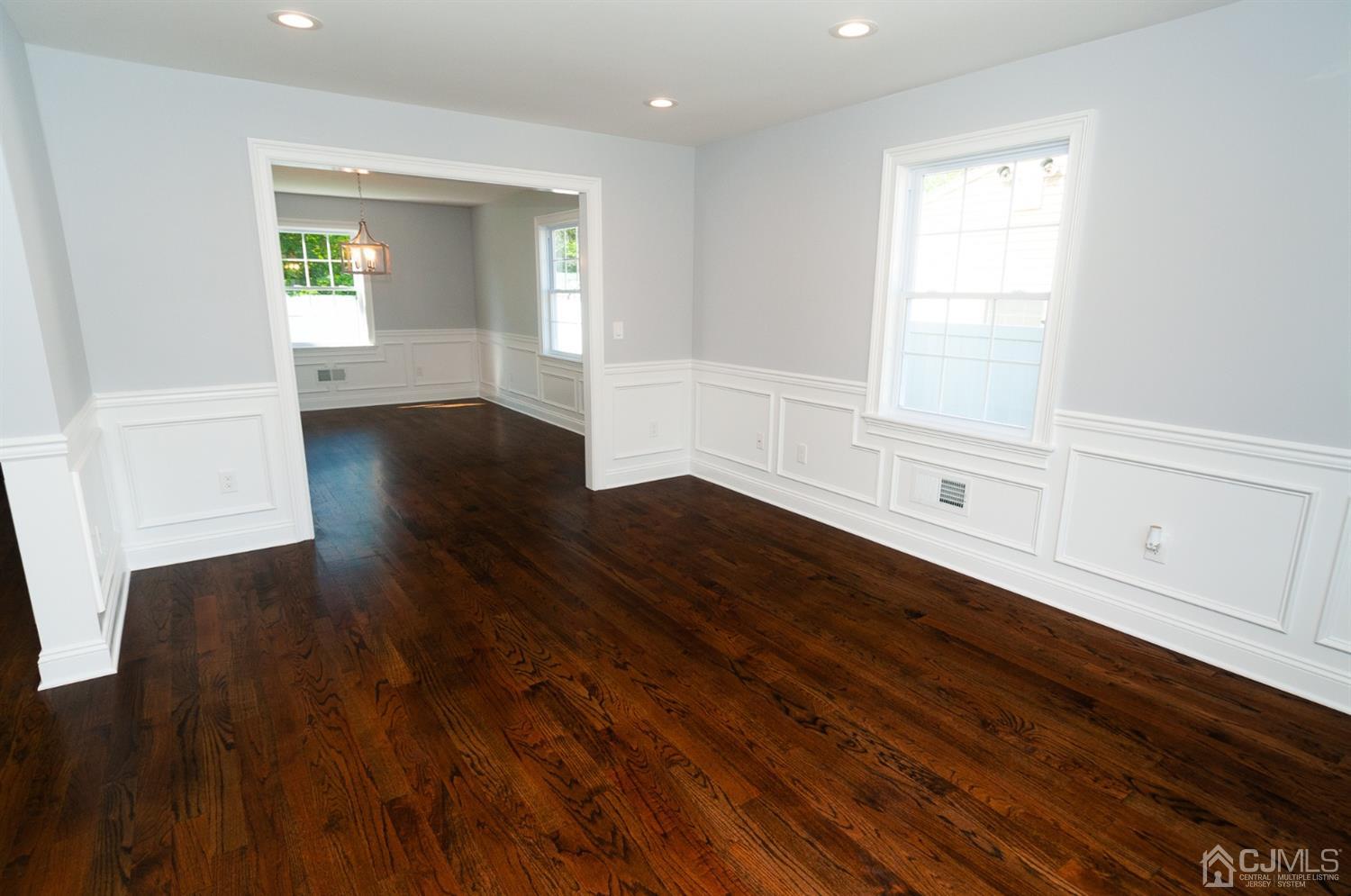 21 Stockton Road New Brunswick, NJ 08901 - Photo 19 of 45 a view of an empty room with wooden floor and a window