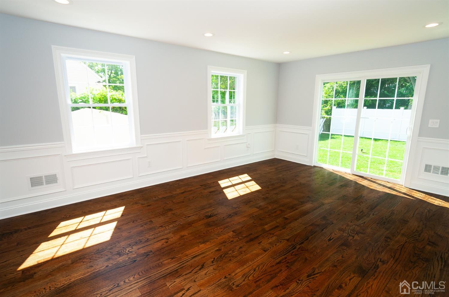 21 Stockton Road New Brunswick, NJ 08901 - Photo 22 of 45 a view of empty room with wooden floor and fan