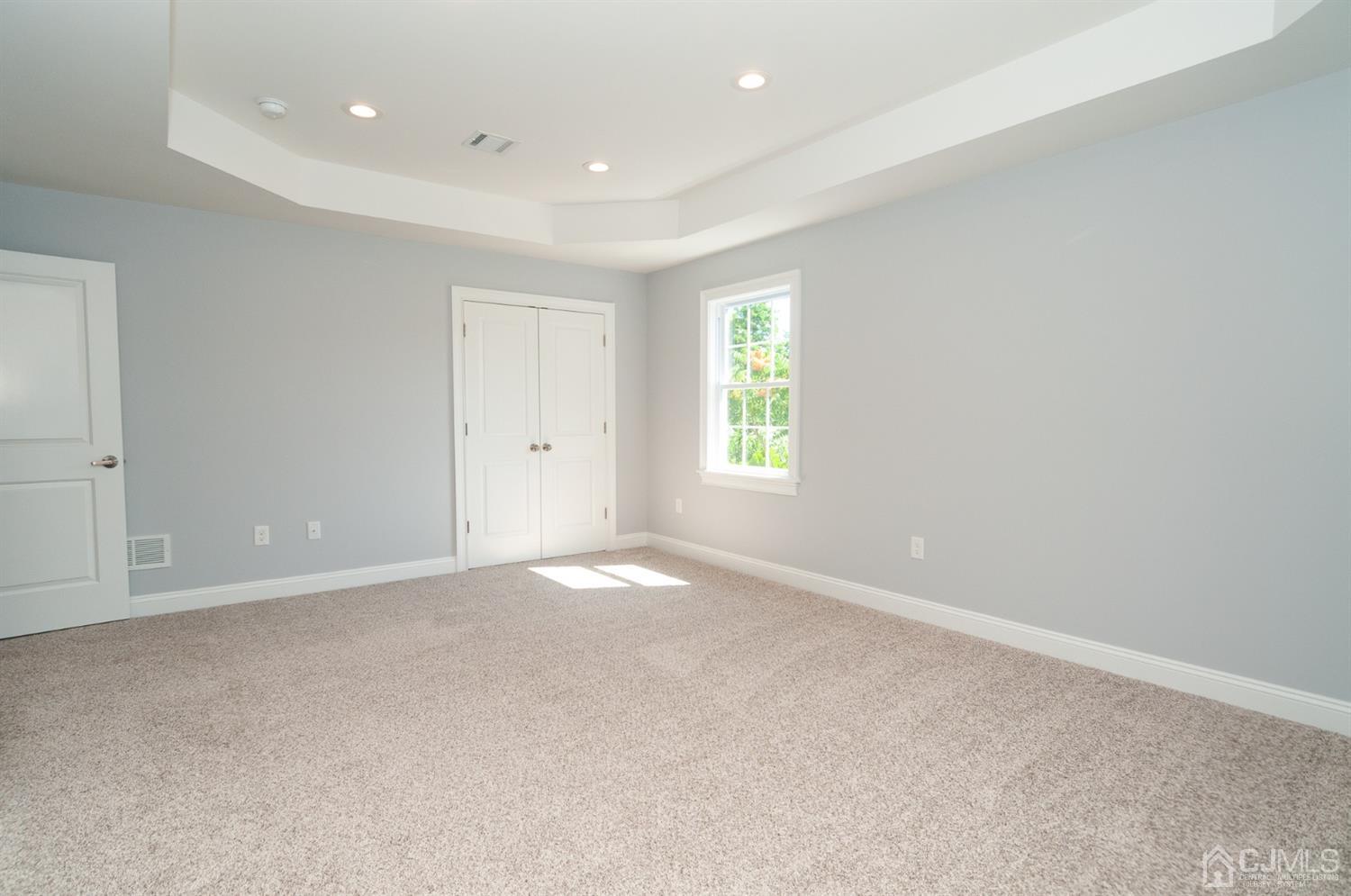 21 Stockton Road New Brunswick, NJ 08901 - Photo 28 of 45 an empty room with windows and closet
