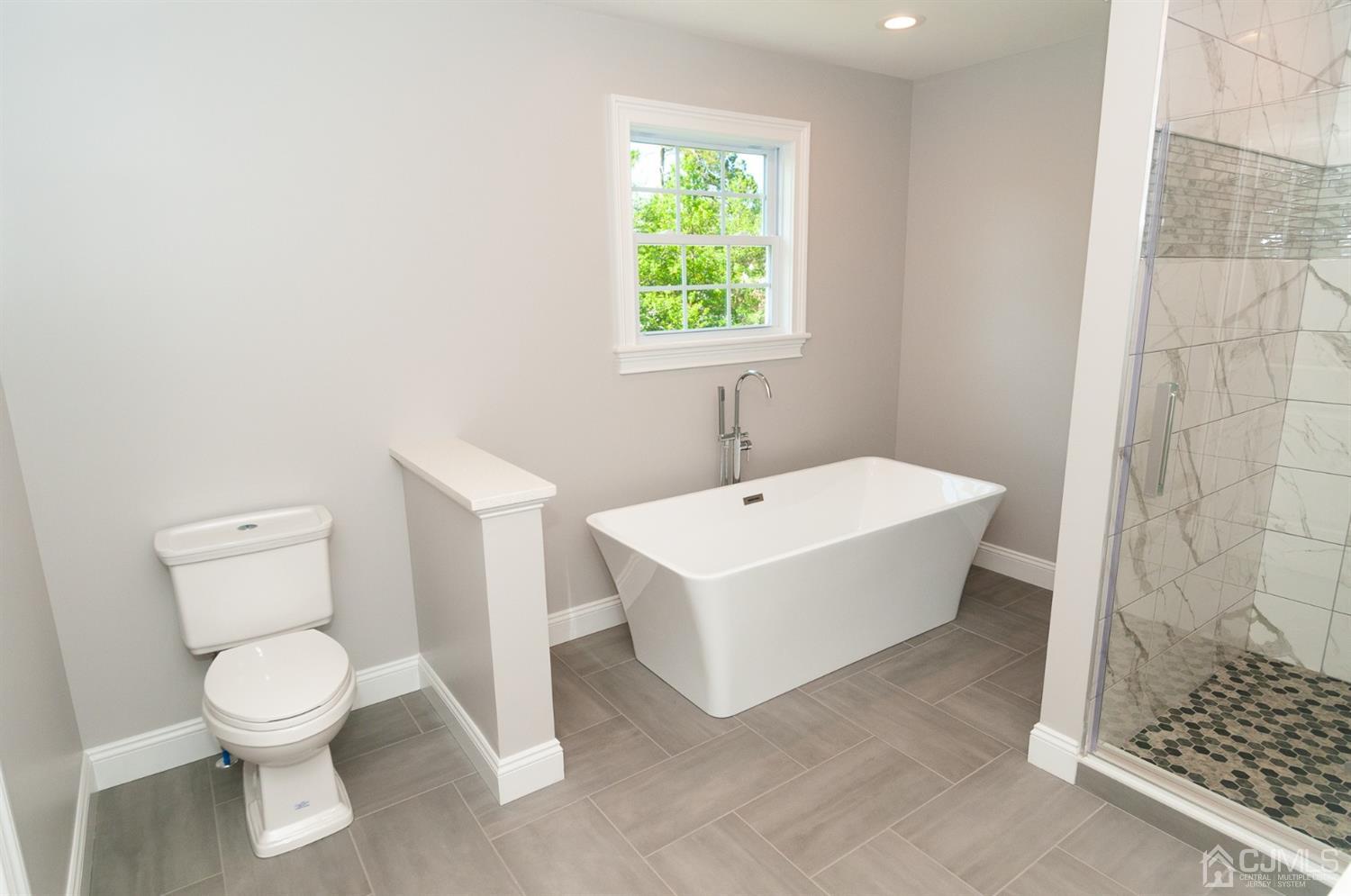 21 Stockton Road New Brunswick, NJ 08901 - Photo 31 of 45 a white toilet sitting next to a bathroom sink