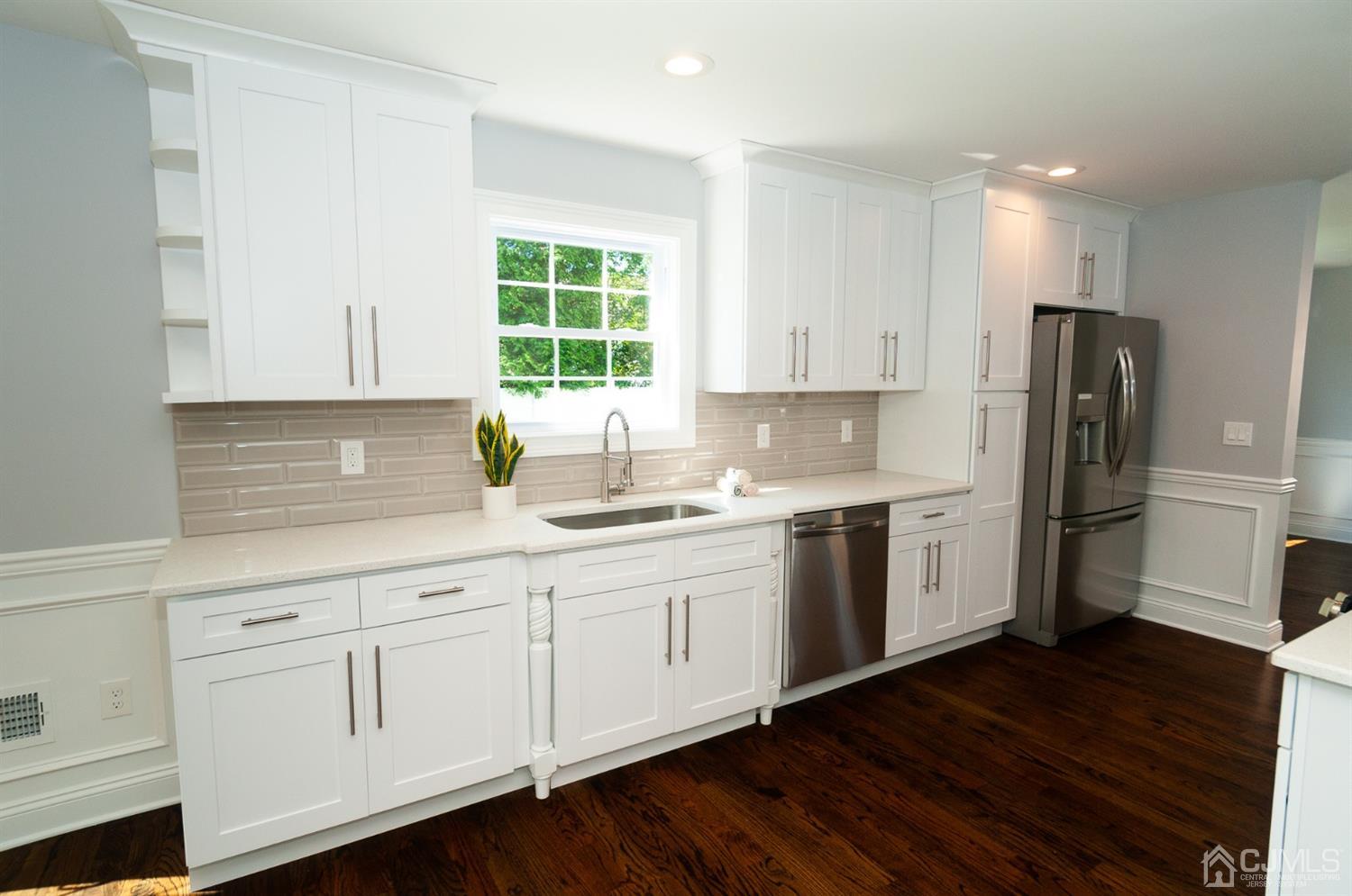 21 Stockton Road New Brunswick, NJ 08901 - Photo 5 of 45 a kitchen with refrigerator and window